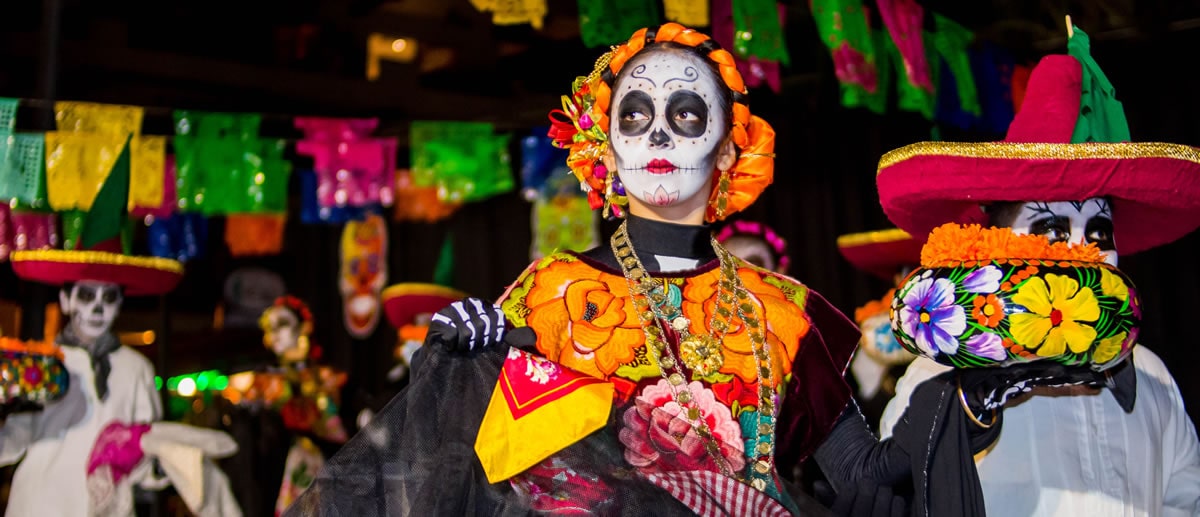 Woman with Catrina makeup celebrating the Day of the Dead.