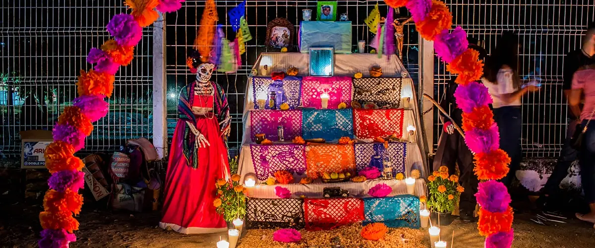 Altar and decorations with catrinas in celebration of the day of the dead.