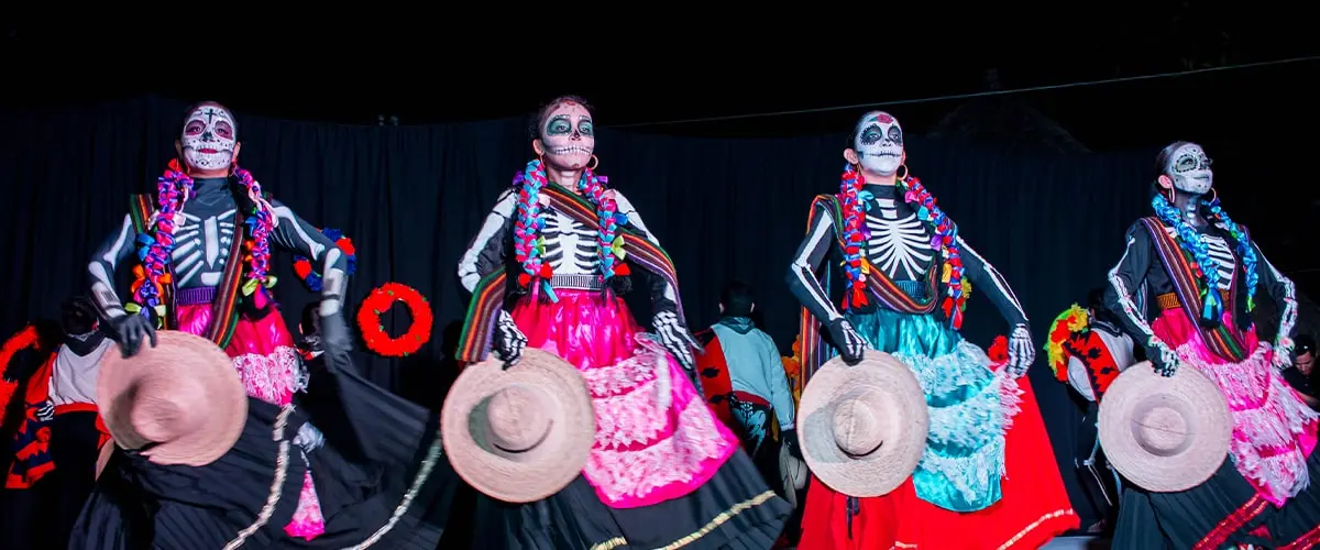 Women with Catrina makeup celebrating the Day of the Dead.