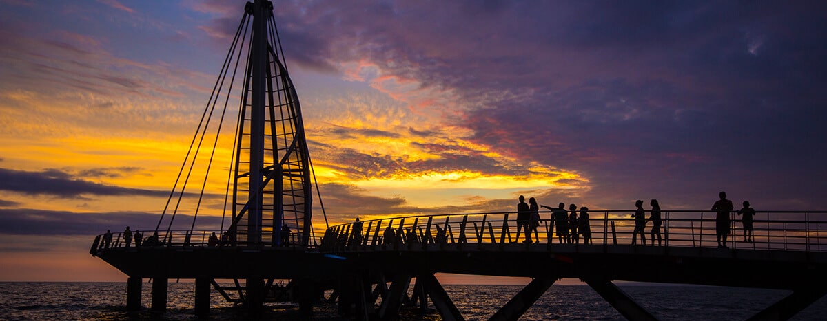 Sunset at Los Muertos Pier in Puerto Vallarta.